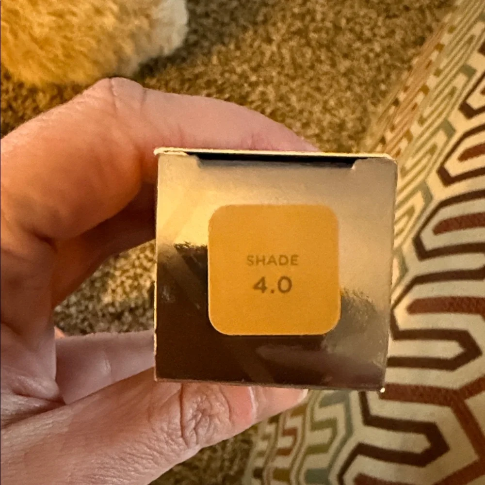 Urban Decay Silver Metallic Foundation Box on Patterned Pillow